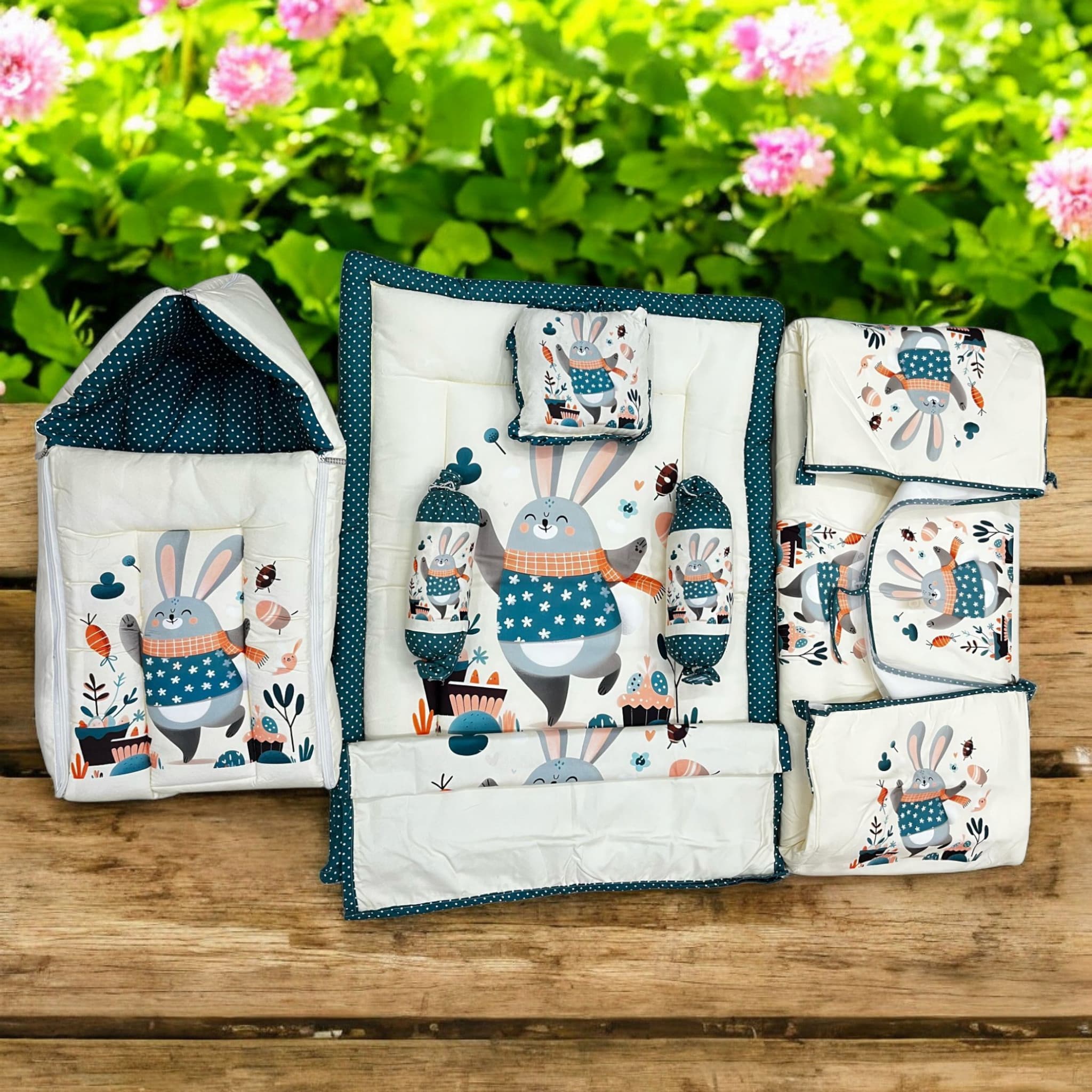 7 in 1 newborn baby bedding combo set in light green with cute elephant and leaf prints. Includes a baby sleeping bag, mattress, two bolsters, pillow, and two zip-up blankets, perfect for comfortable and safe infant sleep. Ideal for baby shower gifts and nursery decor. www.usmile.com